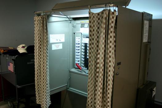 voting booth (wikimedia.org)