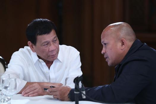 Mass Murderers: Duterte with his former police chief, now a senator, Bato dela Rosa (King Rodriguez/PPD via Wikimedia)