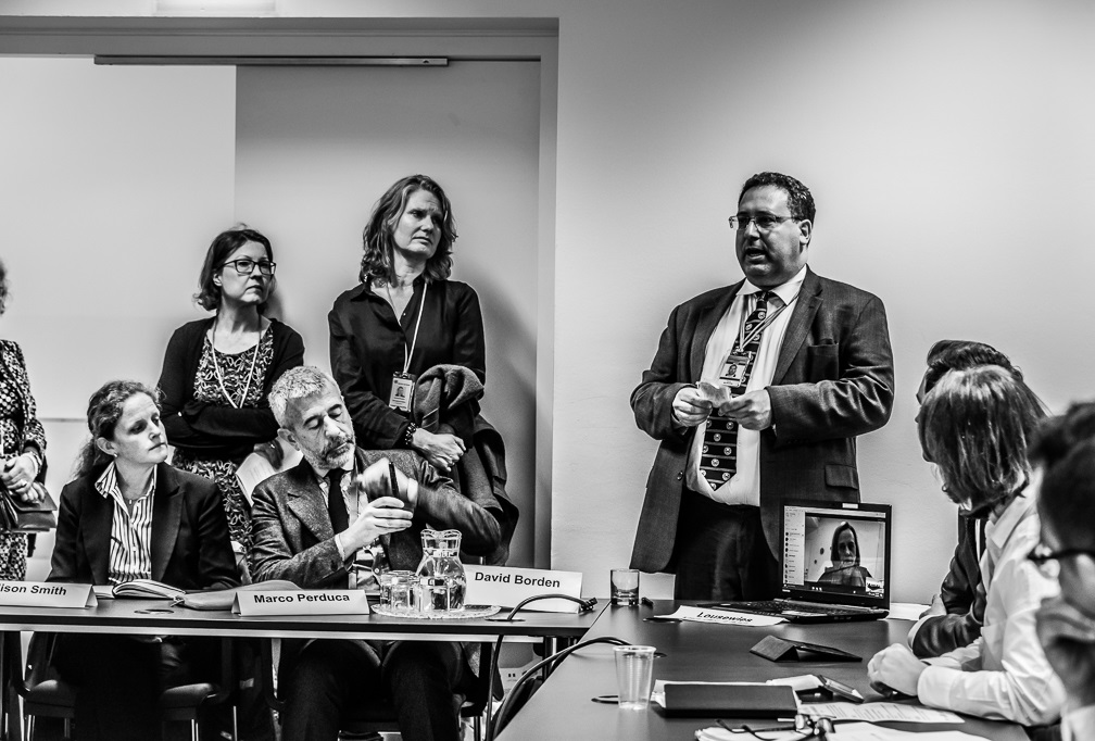 Picture of David Borden speaking to a group seated.