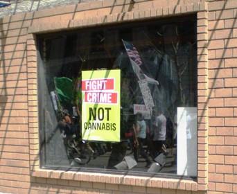 signs in business reflect community support (all photos by Drug War Chronicle)