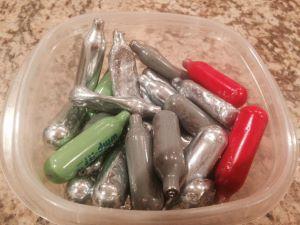 "Whippets"--used nitrous oxide containers. Laughing gas could soon be banned in Britain. (CC)